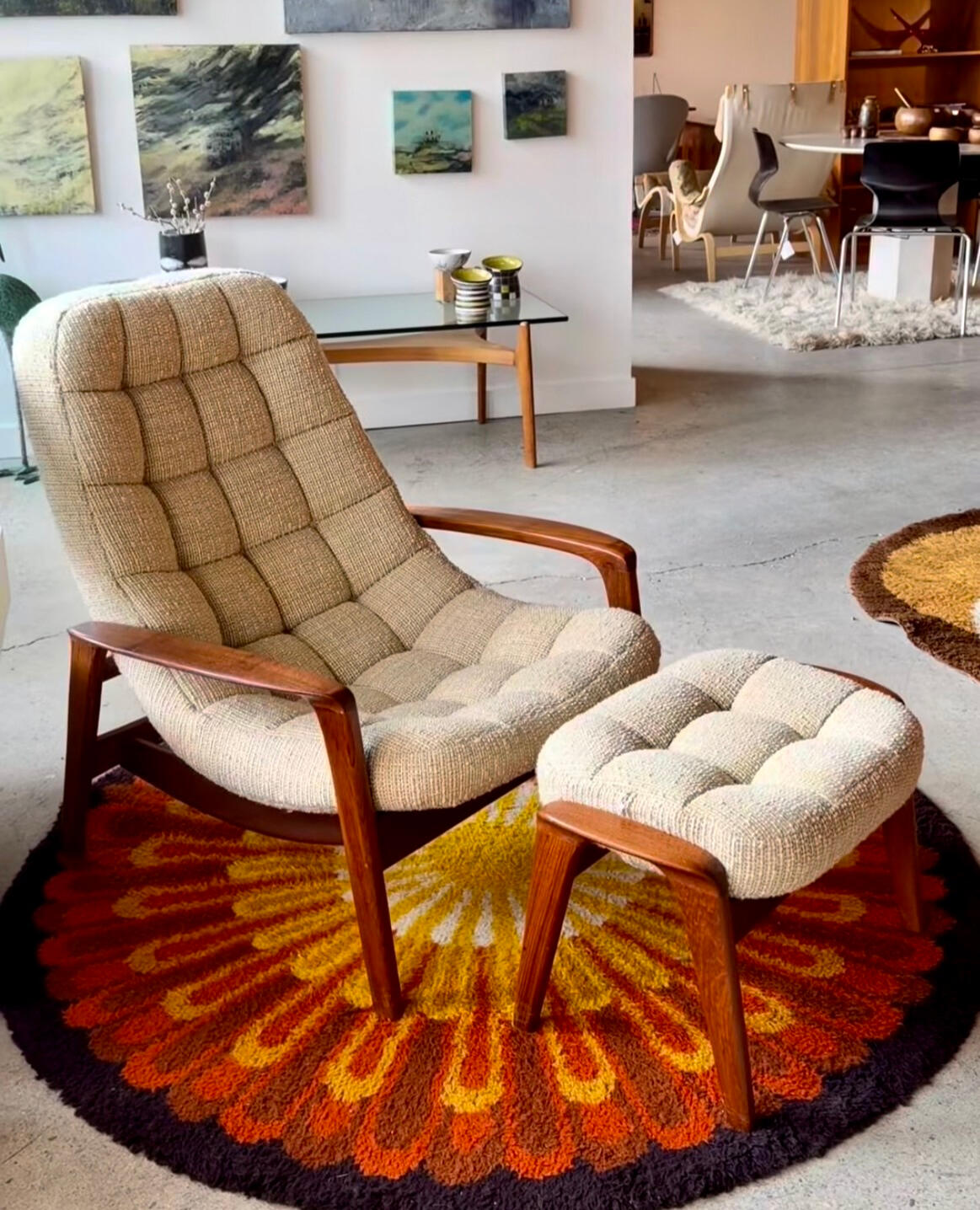 Vintage Huber scoop chair with ottoman. Teak frame and neutral upholstery.
